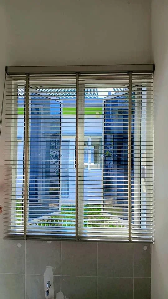 Light Venetian blinds window treatment by Alam Enterprises